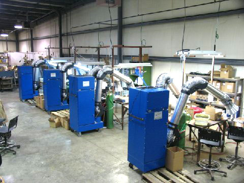 This double arm portable fume and dust collection system removes polutants keeping workers safe Industrial fume collection arms