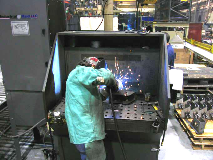 Industrial downdraft tables to protect the health of your workforce Commercial down draft tables for welding, woodworking, grinding and fume collection