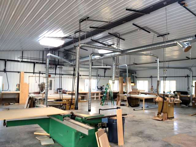 This dust collection system protects the respiratory system of the wood working employees and students Dust collection in vocational work shops